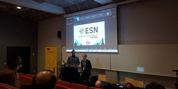 a student is giving a presentation in front of the audience
